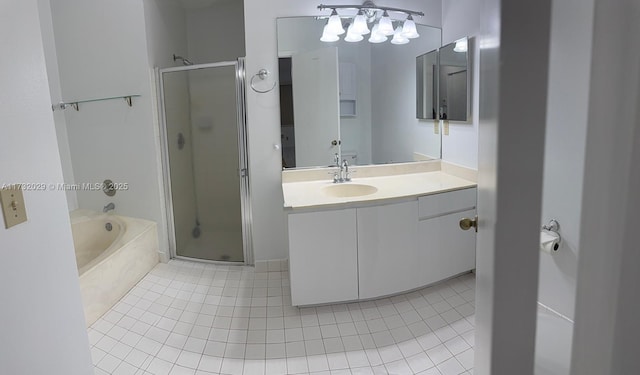 bathroom with independent shower and bath, vanity, and tile patterned floors