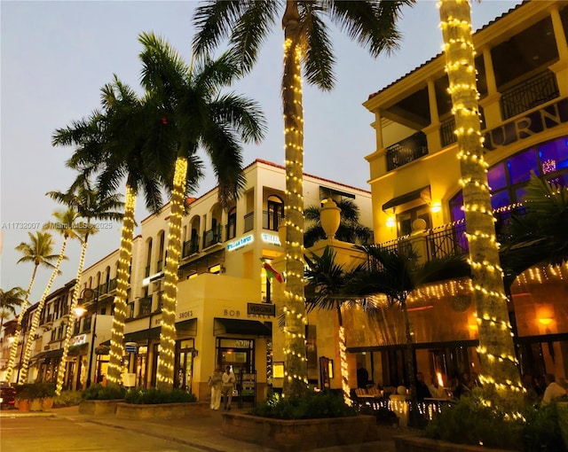 view of outdoor building at dusk