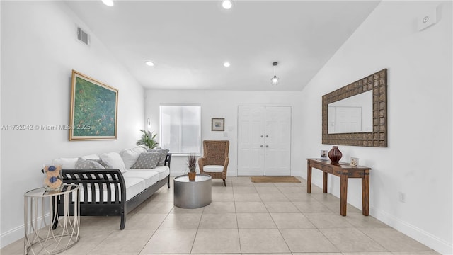 tiled living room featuring lofted ceiling