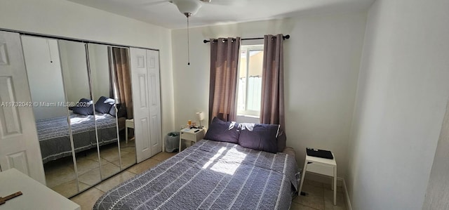 bedroom featuring a closet and light tile patterned floors