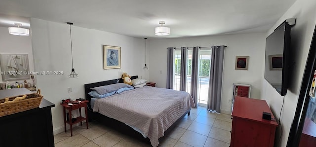 tiled bedroom with access to exterior