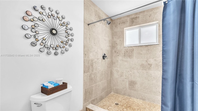 bathroom with walk in shower and toilet