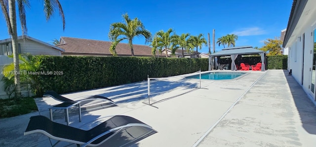 view of pool featuring a gazebo and a patio