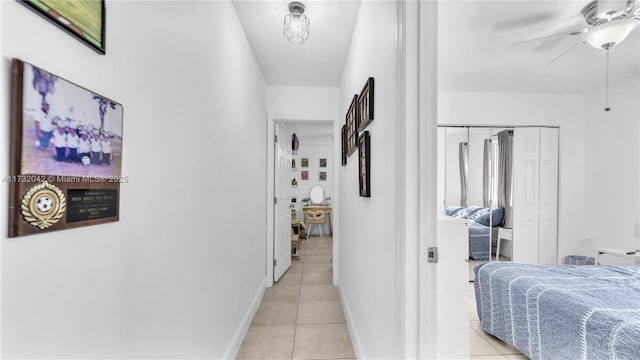 corridor with light tile patterned floors