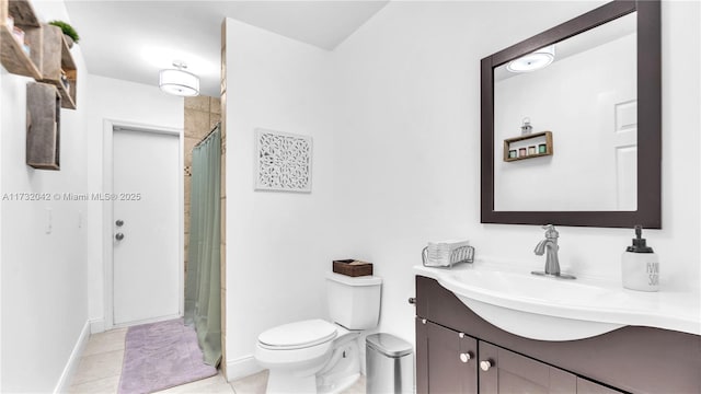 bathroom featuring vanity, a shower with curtain, tile patterned floors, and toilet