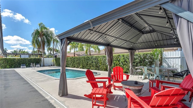 view of swimming pool featuring a gazebo and a patio