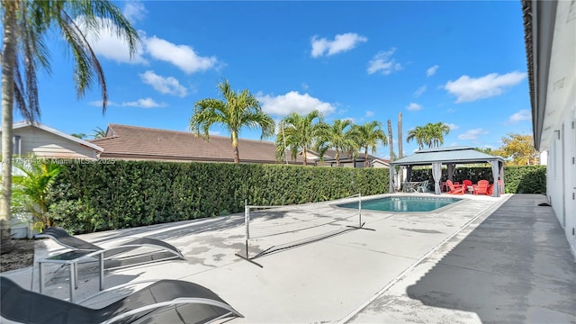 view of swimming pool with a gazebo and a patio area