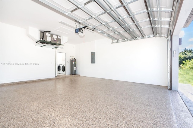 garage with a garage door opener, electric panel, electric water heater, and washer and dryer