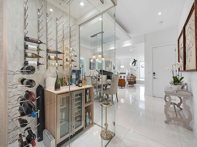 wine room featuring light tile patterned floors and beverage cooler