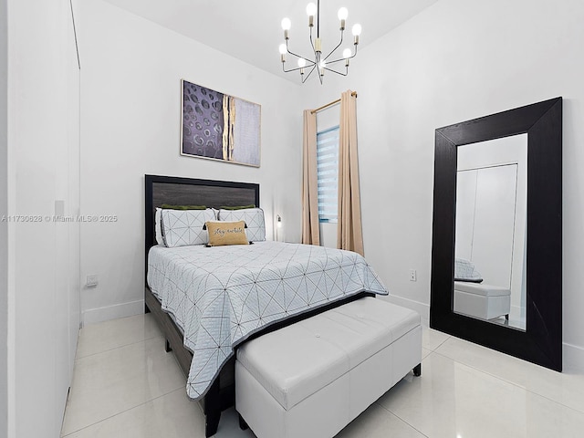 bedroom featuring a notable chandelier and light tile patterned flooring