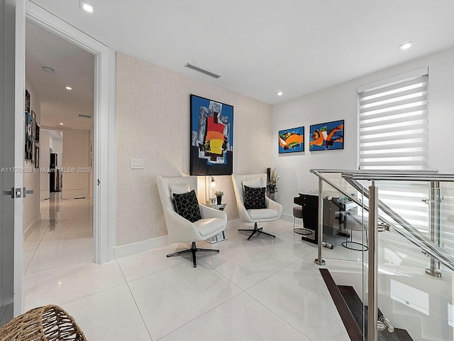 sitting room with light tile patterned floors