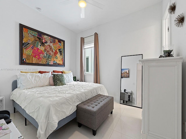 tiled bedroom with ceiling fan