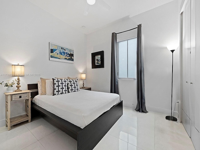 bedroom featuring light tile patterned floors and ceiling fan