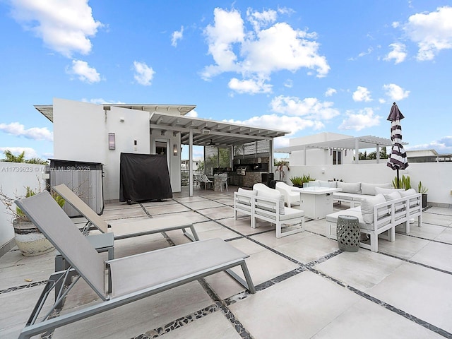 view of patio / terrace with an outdoor hangout area and exterior kitchen