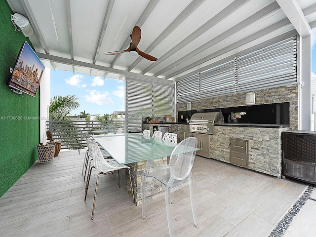 sunroom / solarium with beamed ceiling and ceiling fan