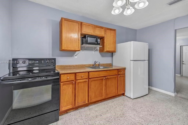 kitchen featuring a chandelier, sink, and black appliances