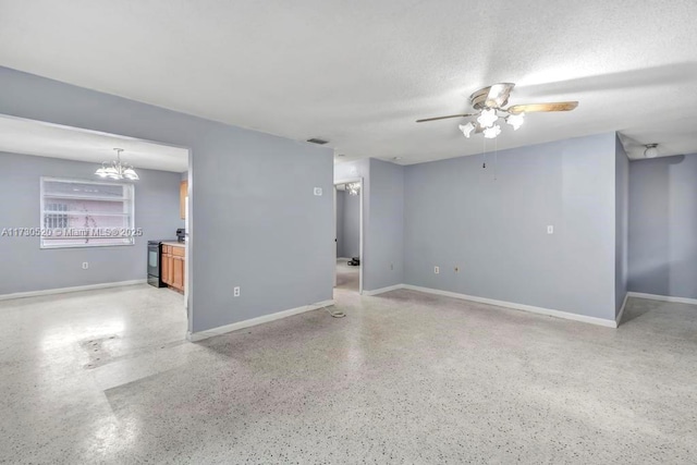 unfurnished room featuring ceiling fan and a textured ceiling