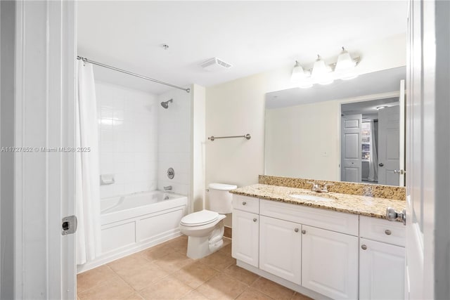 full bathroom with tile patterned floors, toilet, vanity, and shower / bath combo