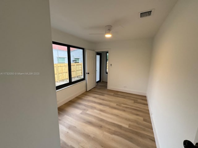 spare room with ceiling fan and light hardwood / wood-style floors