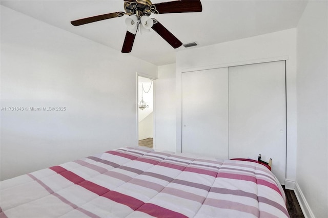 bedroom featuring wood-type flooring, a closet, and ceiling fan