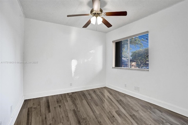 spare room featuring hardwood / wood-style flooring, ceiling fan, and a textured ceiling