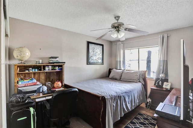 bedroom featuring ceiling fan, dark hardwood / wood-style floors, and a textured ceiling