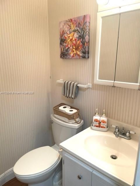 bathroom with vanity and toilet