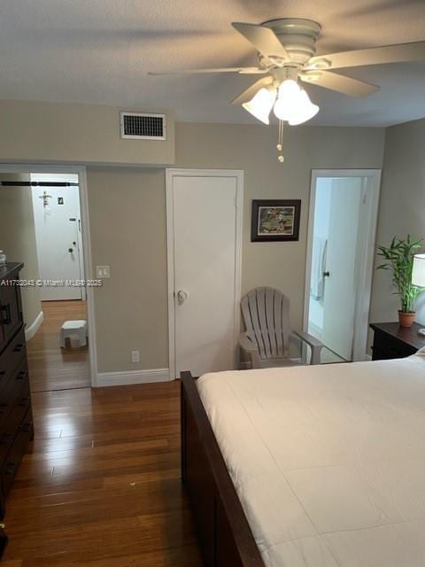 bedroom featuring dark wood-type flooring and ceiling fan