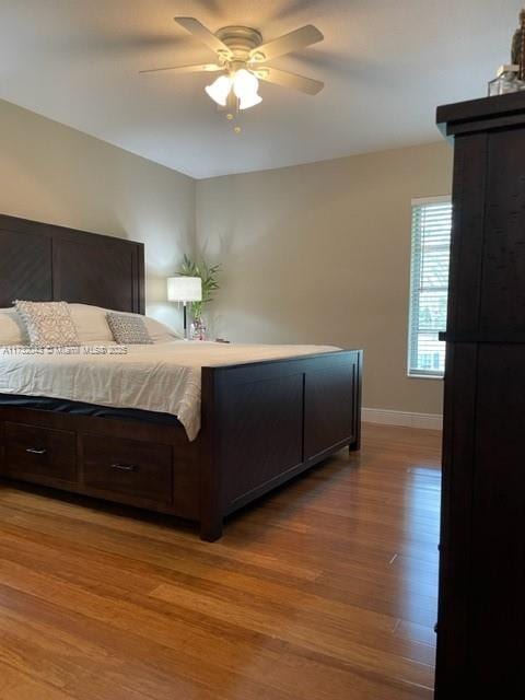 bedroom with ceiling fan and light wood-type flooring