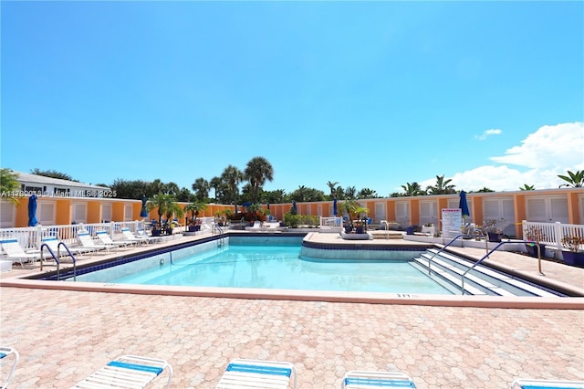 view of swimming pool featuring a patio area