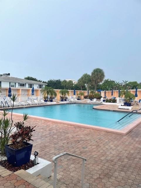 view of pool featuring a patio