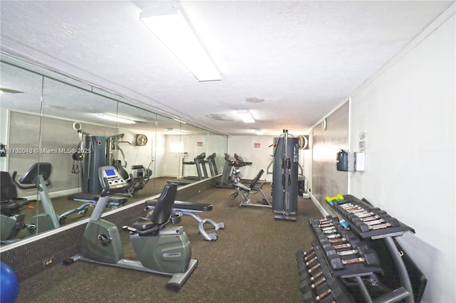 gym featuring a textured ceiling