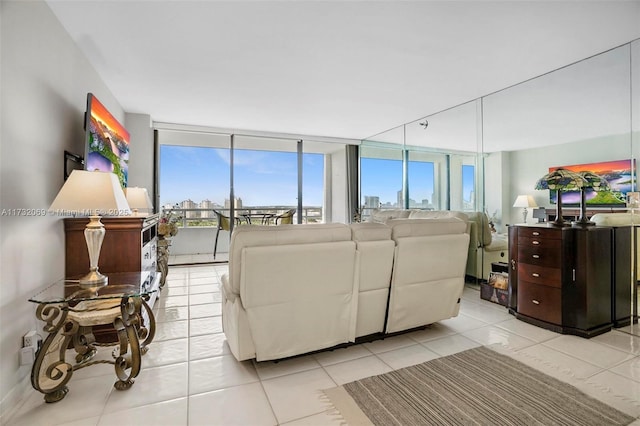 living room featuring floor to ceiling windows and light tile patterned flooring