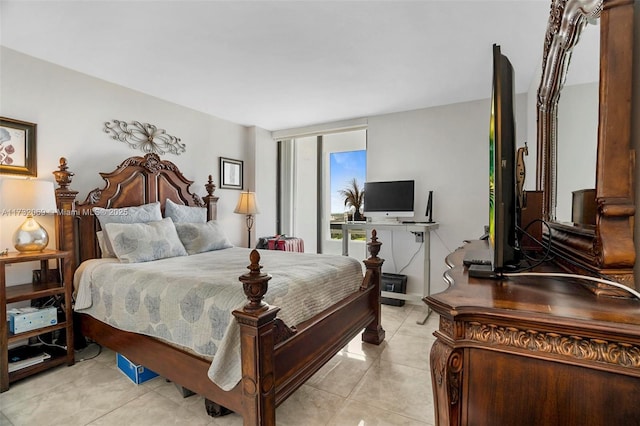 bedroom with light tile patterned floors