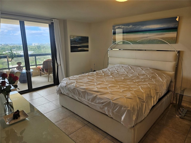 tiled bedroom with a wall of windows