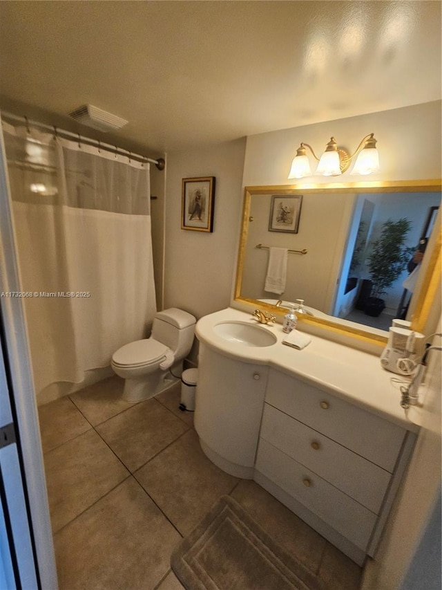 bathroom with tile patterned flooring, vanity, toilet, and a shower with shower curtain