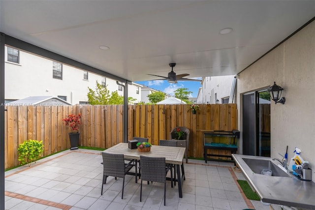 view of patio featuring ceiling fan