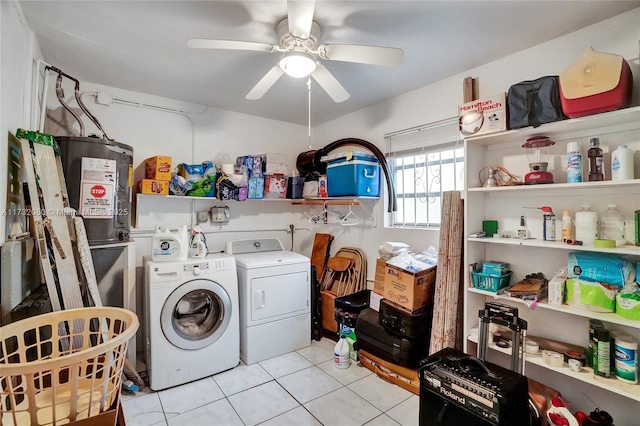 clothes washing area with light tile patterned floors, washing machine and clothes dryer, and ceiling fan