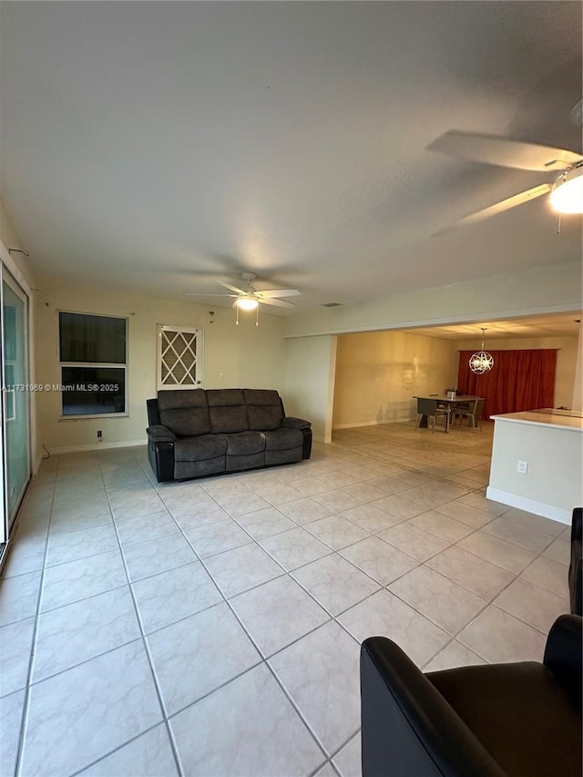 living room with light tile patterned floors and ceiling fan