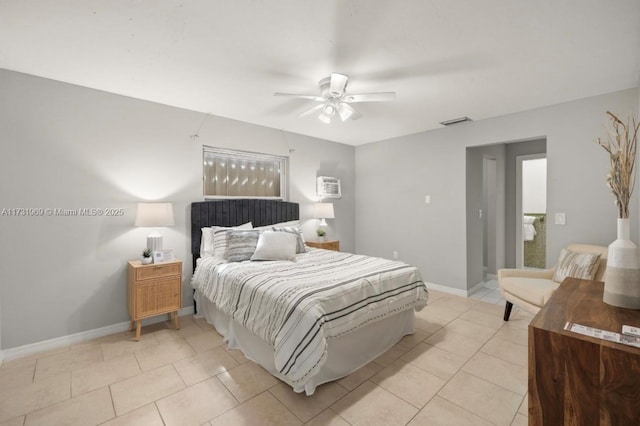 bedroom featuring light tile patterned floors, ceiling fan, visible vents, and baseboards