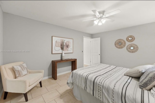 bedroom with light tile patterned floors, ceiling fan, and baseboards