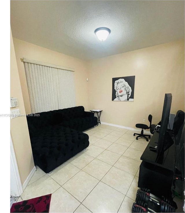 tiled living room with a textured ceiling