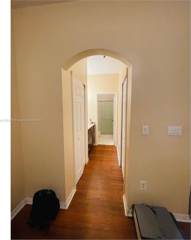 hallway featuring wood-type flooring