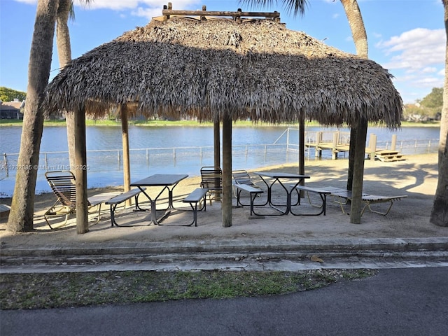 view of property's community featuring a water view and a gazebo