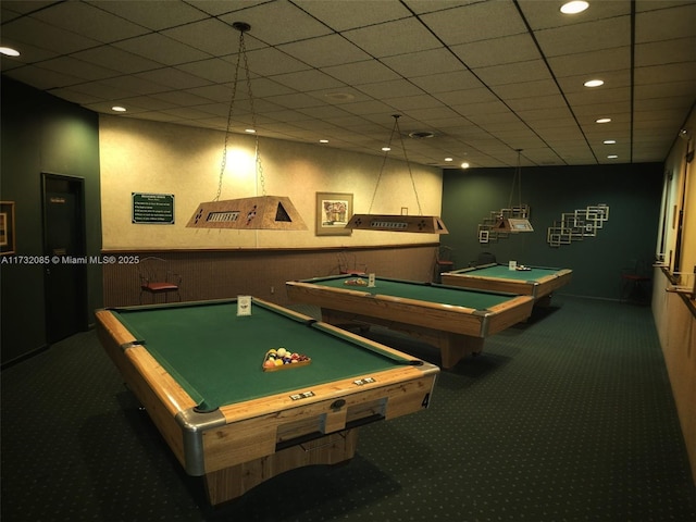 game room with a drop ceiling, pool table, and dark colored carpet