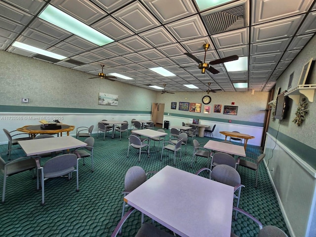 interior space with carpet floors and ceiling fan