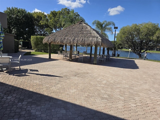 view of home's community with a gazebo and a water view