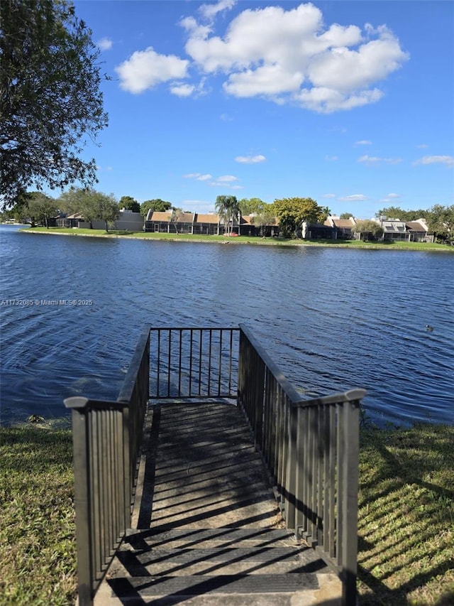 view of dock with a water view