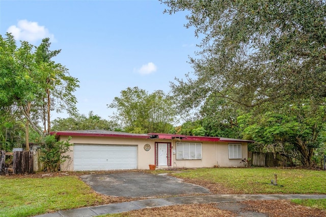 view of front facade with a garage and a front yard