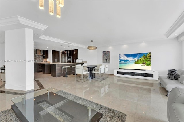 living room featuring crown molding